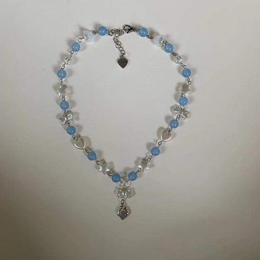 blue pastel bow strawberry necklace