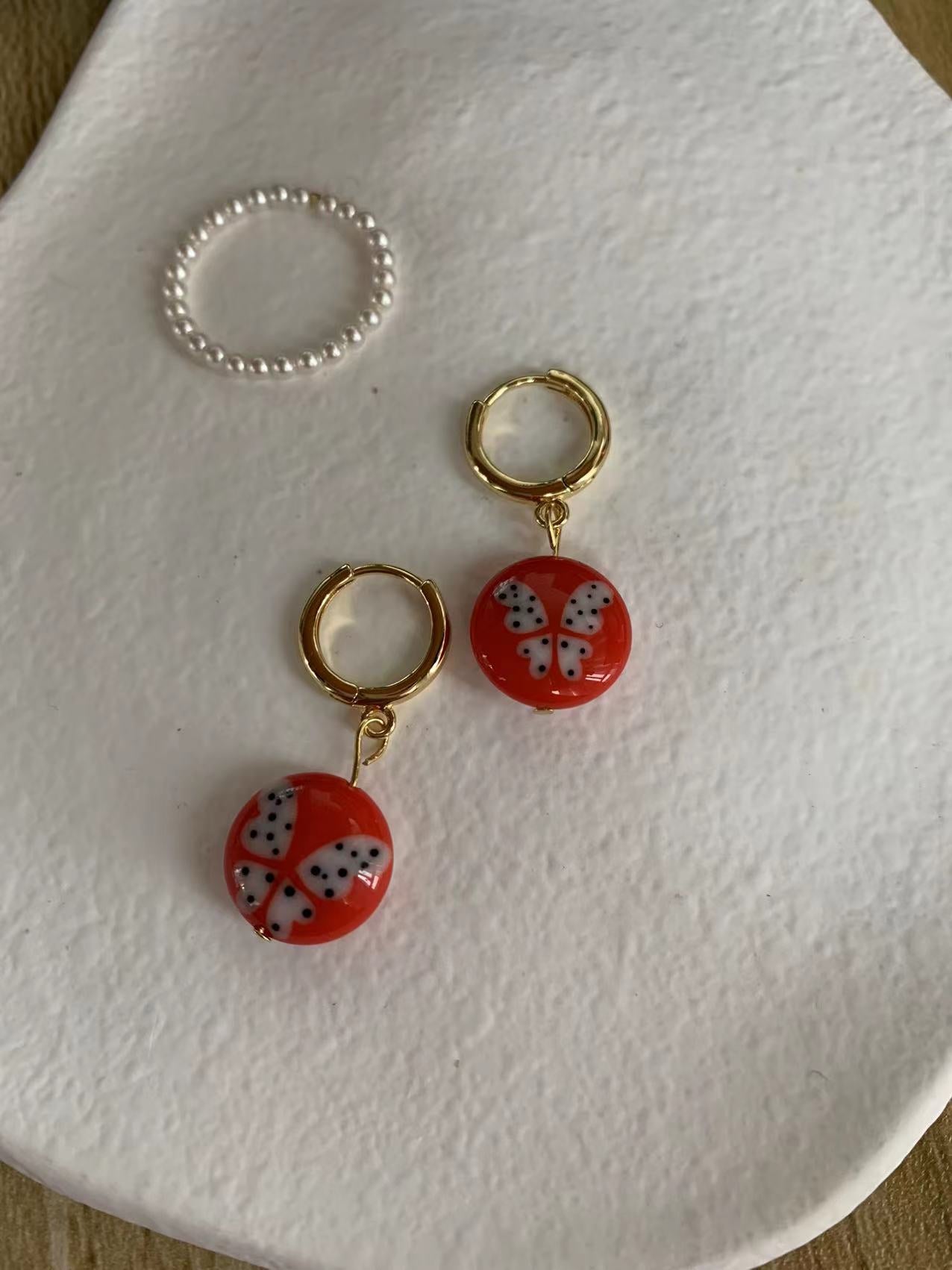Red butterfly disc earrings